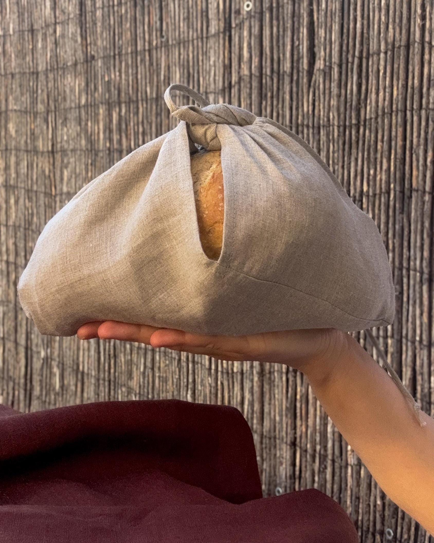 Linen bread bag closed around a loaf of bread