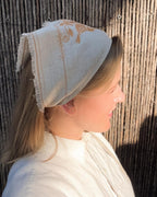 Embroidered natural linen bandana, side profile