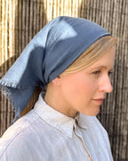 Blue linen square scarf tied as a headscarf